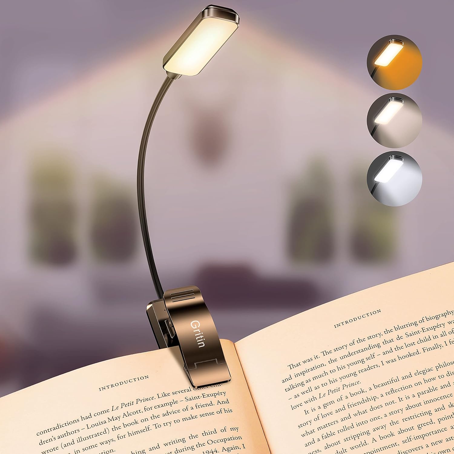 Rechargeable clip-on LED book light attached to an open book