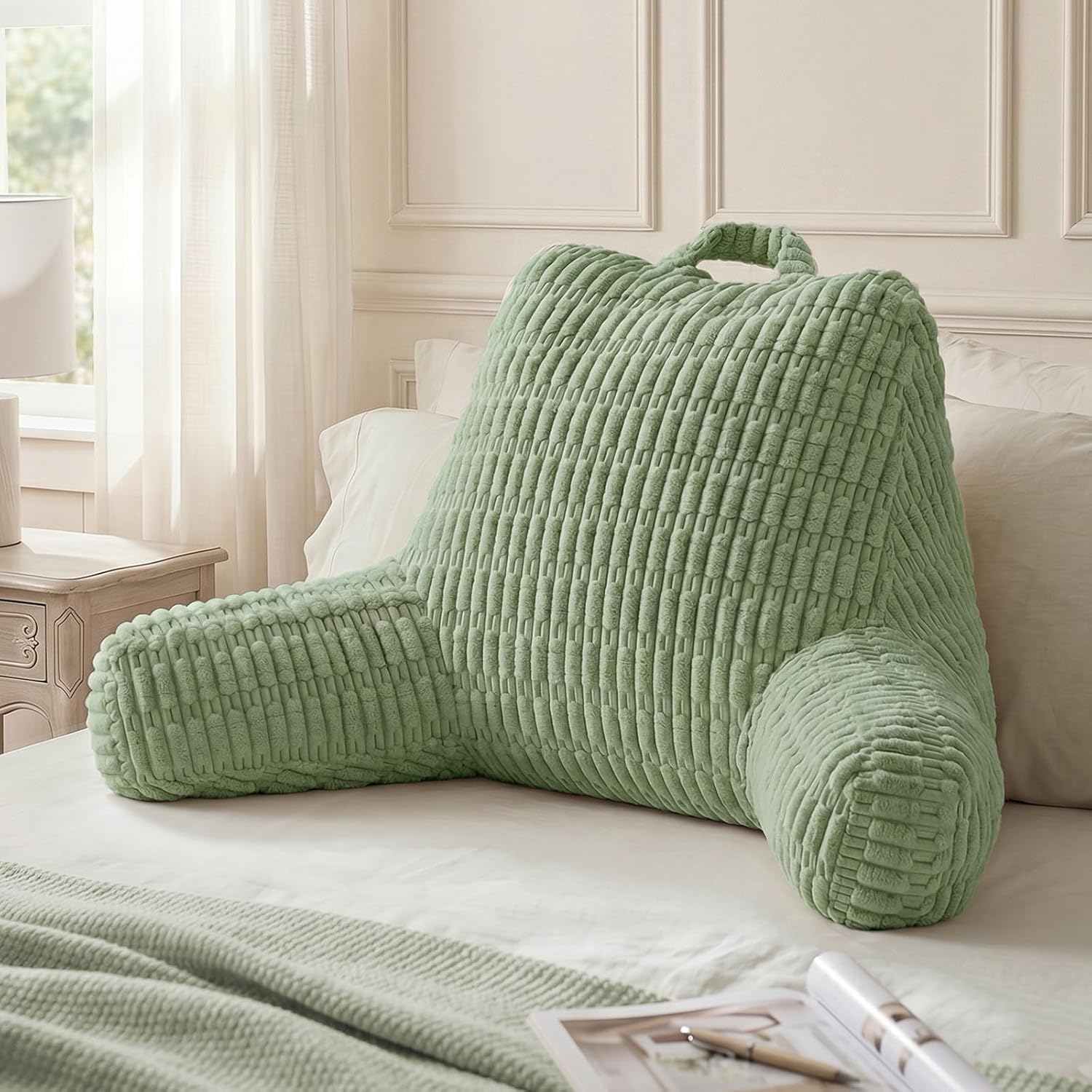 Sage green reading backrest pillow with arms and side pockets